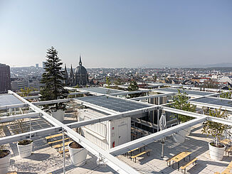 Roof terrace of IKEA Westbahnhof in Vienna with a view of the city.