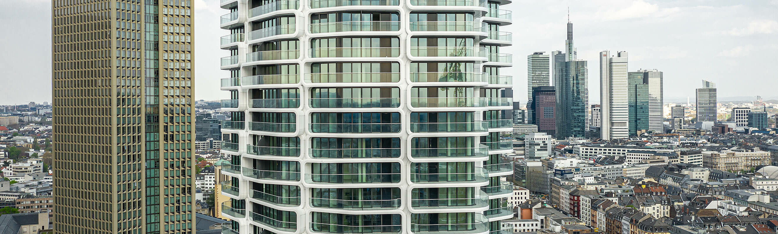 Skyline of Frankfurt with the glass façade of the Grand Tower.