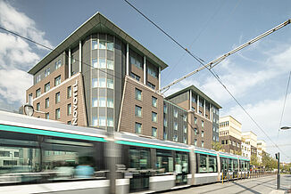 Passing tram in front of the Novotel Hotel in Paris.