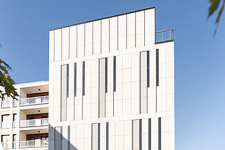 Façade with balconies of the Piano House residential complex in Warsaw.