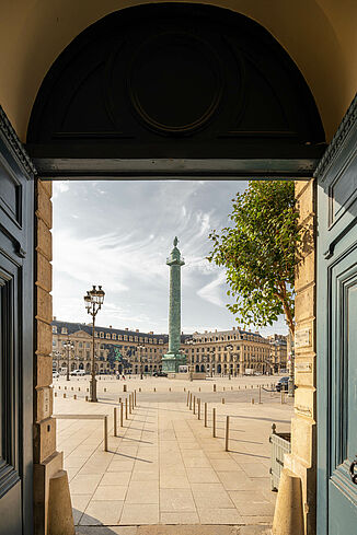 View through a door of the prestigious Ritz Hotel on Place Vendôme in Paris.