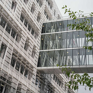 Glass connecting bridge between two buildings on the upper floors of the Conseil Régional of the Île de France region in Paris.