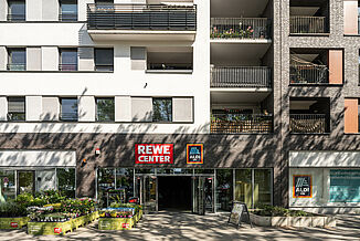 Entrance to the Aldi and Rewe supermarkets in the Alea Quartier in Frankfurt.