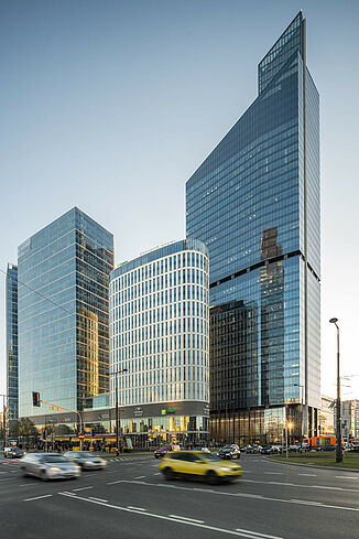 View across the busy road to the Skyliner Tower in Warsaw.