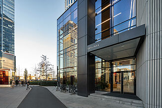Glazed entrance area of the Skyliner Tower in Warsaw.