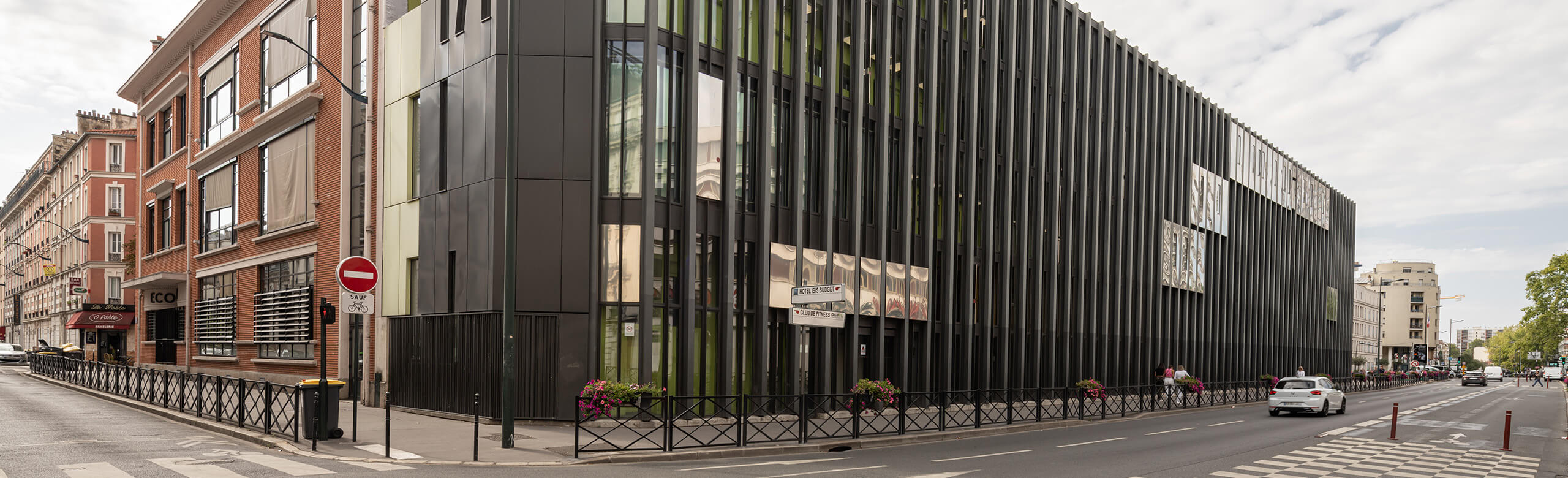 Street view of the award-winning architectural building by Bernard Desmoulins, which houses the Léo Délibes music school in Paris.